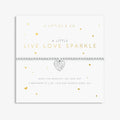 A close-up of a bracelet featuring the words "live," "love," and "sparkle" in a charming design.
