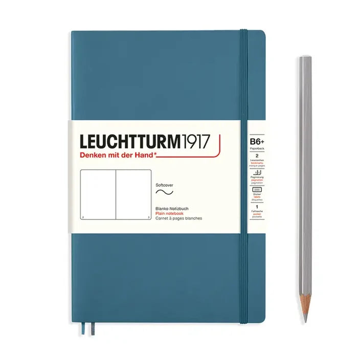 Blue notebook with Leuchtturm1917 branding and a pencil on a white background