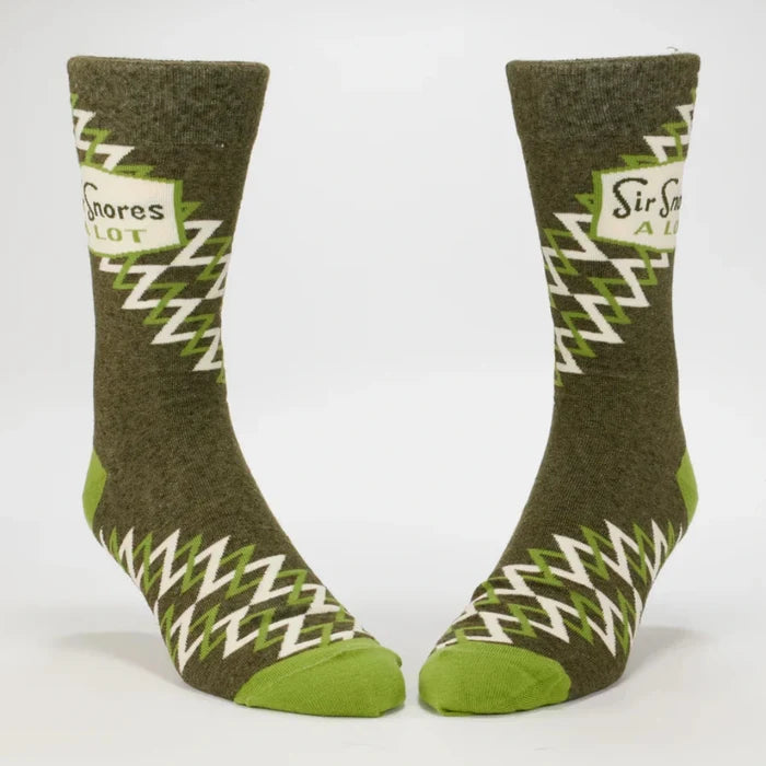 Pair of green socks with zigzag pattern on a white background