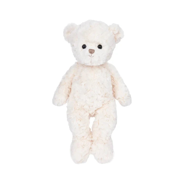 A white teddy bear with black eyes, sitting upright and looking friendly.