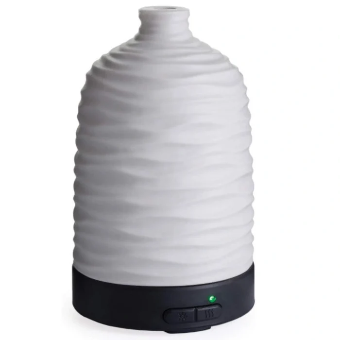 This Candle Warmers Airome Harmony Medium ultrasonic Essential Oil Diffuser releases a fine, cool mist that carries your favorite essential oils throughout your space.