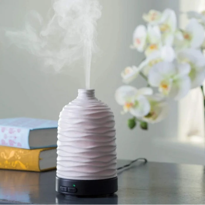 This Candle Warmers Airome Harmony Medium ultrasonic Essential Oil Diffuser releases a fine, cool mist that carries your favorite essential oils throughout your space.