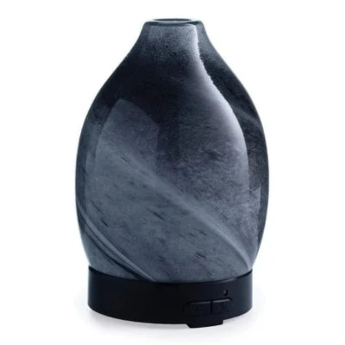 The Airomé Obsidian Medium Ultrasonic Essential Oil Diffuser by Candle Warmers uses ultrasonic technology to disperse a fine, cool mist into any room.