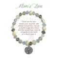 A close-up of a mom's love bracelet featuring a delicate heart charm, symbolizing affection and connection.