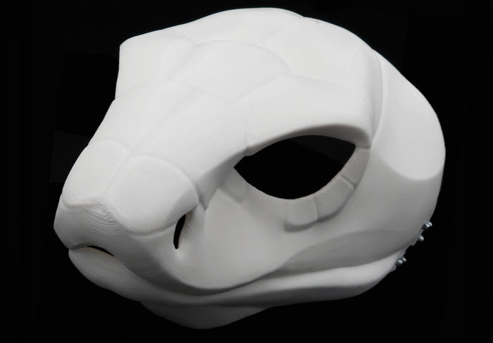 Photo showing a white, plastic 3D printed cobra snake fursuit head base complete with metal hardware at a 3/4 angle against a black background.