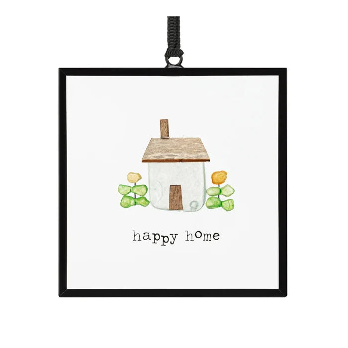 A vibrant framed print depicting a happy home, showcasing warmth and inviting details.