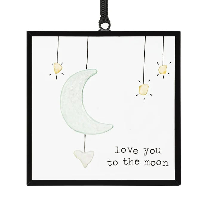 A beautifully crafted ornament inscribed with "I love you to the moon and back," ideal for sentimental gifting.