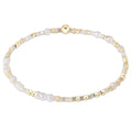 enewton design Hope Unwritten Bracelet featuring Snow color seed beads with 14k gold-filled accents displayed in a circular layout on a white background.