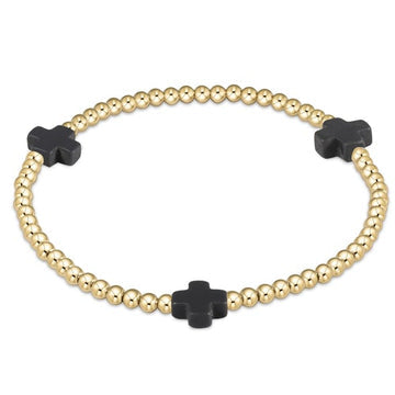 enewton design Signature Charcoal Cross Pattern Bracelet with 3mm gold beads and black cross accents on white background