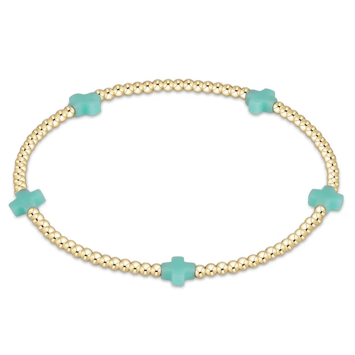 enewton design Signature Cross Pattern Bracelet with gold beads and mint cross accents on white background