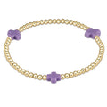 enewton design Signature Cross Pattern Bracelet with gold beads and purple cross accents on white background