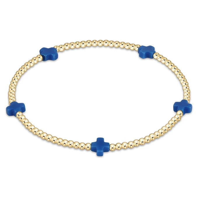 enewton design Signature Cross Pattern Bracelet with gold beads and cobalt cross accents on white background