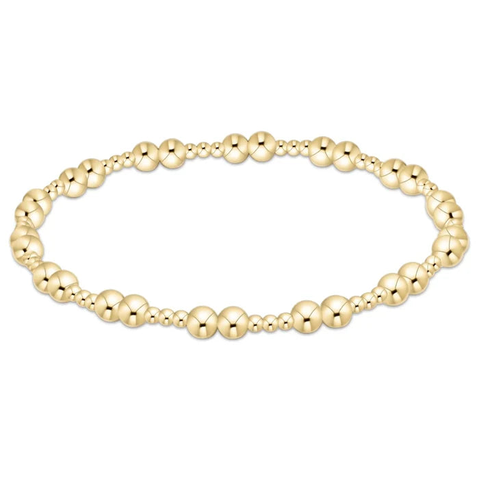 Gold‑filled beaded bracelet with 2mm and 4mm beads on elastic, available in two sizes
