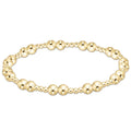 Gold‑filled beaded bracelet with 2.5mm and 5mm beads on elastic, available in standard and extended sizes.
