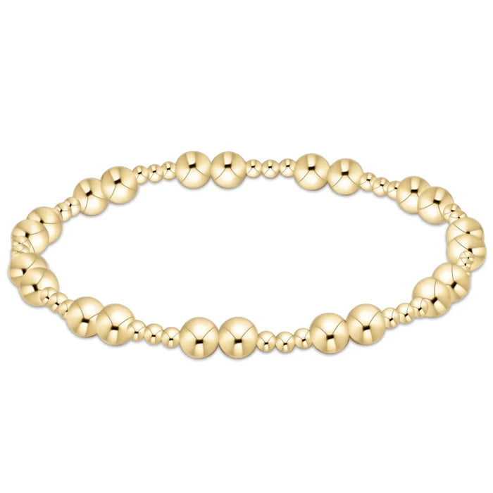 Gold‑filled beaded bracelet with 2.5mm and 5mm beads on elastic, available in standard and extended sizes.