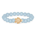 Fahlo Journey Aqua Glow Sea Turtle Bracelet featuring glow-in-the-dark aqua beads, engraved turtle charm, interactive real sea turtle tracking, and support for marine wildlife conservation.