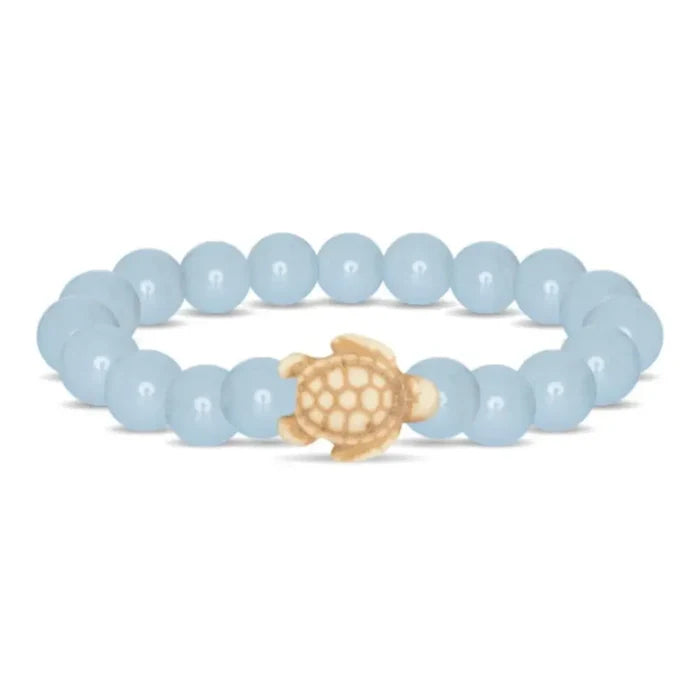 Fahlo Journey Aqua Glow Sea Turtle Bracelet featuring glow-in-the-dark aqua beads, engraved turtle charm, interactive real sea turtle tracking, and support for marine wildlife conservation.