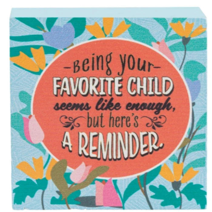 This Ganz Humor Helps Mom Block Talk 24-Piece Set brings a cheerful touch of humor to any mom’s space.