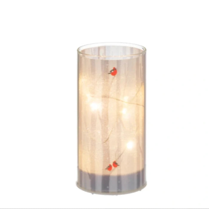 The Ganz LED Light Up Cardinal on Birch Tree Pillar Set features a vibrant red cardinal perched on a beautifully detailed birch tree pillar illuminated by soft LED light.