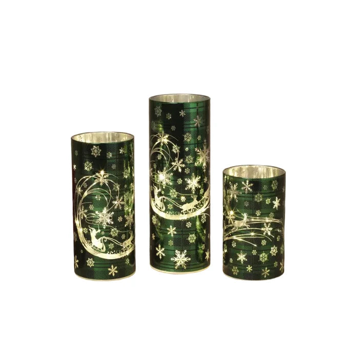 This Gerson Green Lighted Glass Holiday Design Cylinder Luminary brings a warm and festive glow to your Christmas décor.
