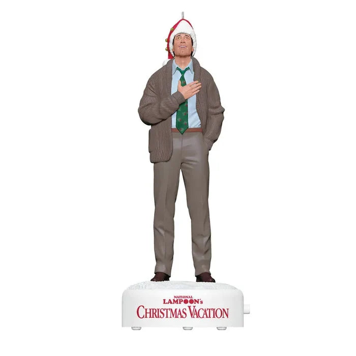 Front view of 2026 Clark Griswold ornament with green patterned tie and awestruck expression on snow base