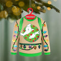Ghostbusters light-up sweater ornament against blurred pine branches with bokeh lights