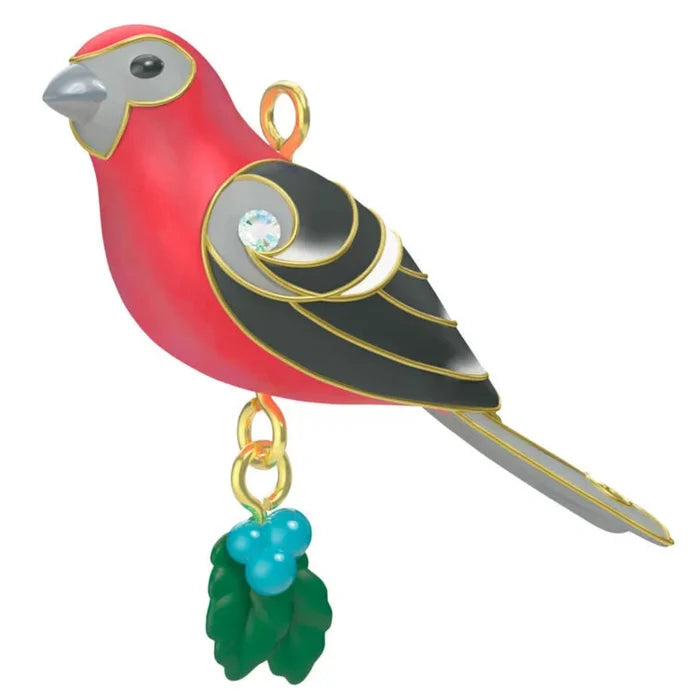 Colorful bird-shaped ornament with a gold chain on a white background