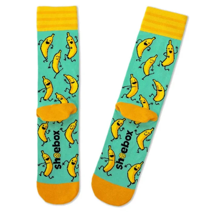Two socks with banana pattern and 'shoebox' branding on a white background