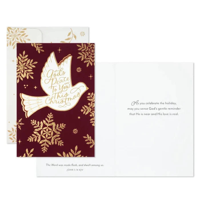 Christmas card with gold dove and snowflakes on a red background