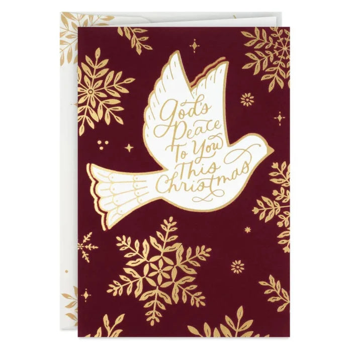 Greeting card with a dove and snowflakes on a red background
