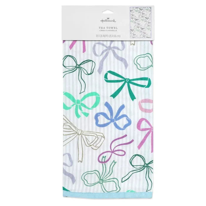 Tea towel with colorful bow pattern in packaging