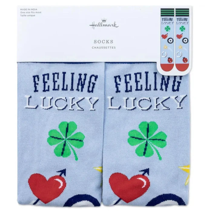 Pair of socks with 'Feeling Lucky' text and clover designs on a light blue background, with Hallmark branding.