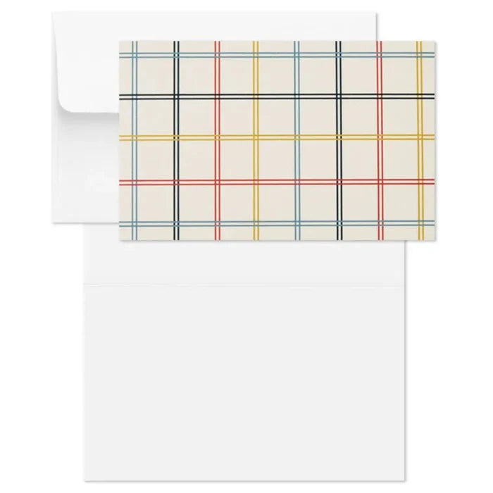 Plaid patterned paper and envelope on a white background