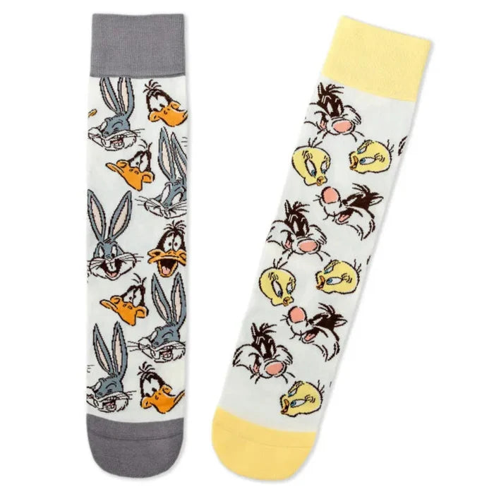 Two socks with cartoon character patterns on a white background