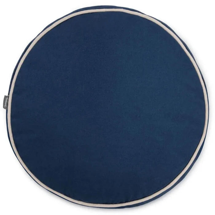 Round navy blue cushion with white trim on a white background