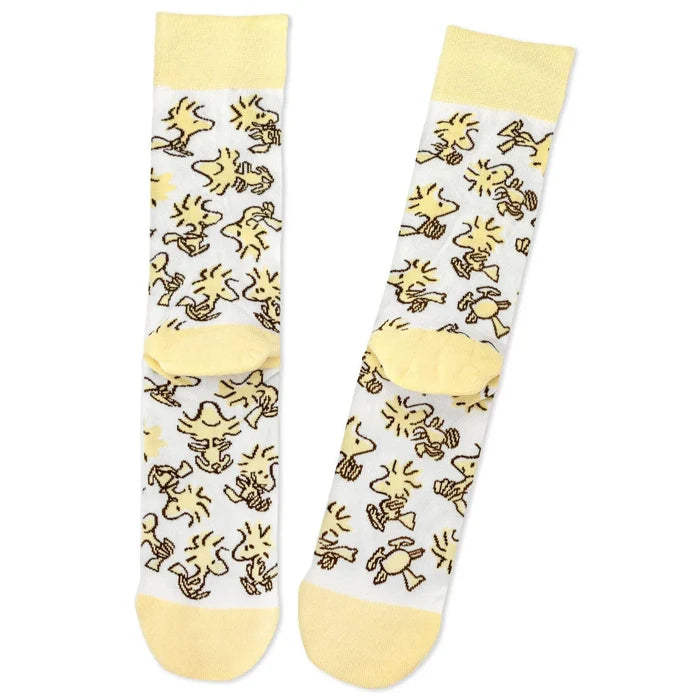 Pair of  Woodstock socks with yellow and white design on a white background