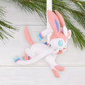 Hallmark Pokemon Sylveon Christmas ornament hanging on a Christmas branch