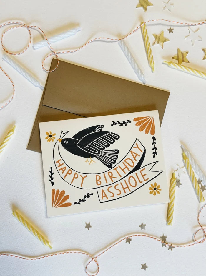 Birthday card with a bird illustration and 'Happy Birthday Asshole' text on a decorative background.