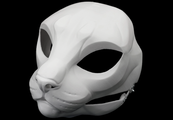 Photo showing a white, plastic 3D printed house cat fursuit head base complete with metal hardware at a 3/4 angle against a black background.