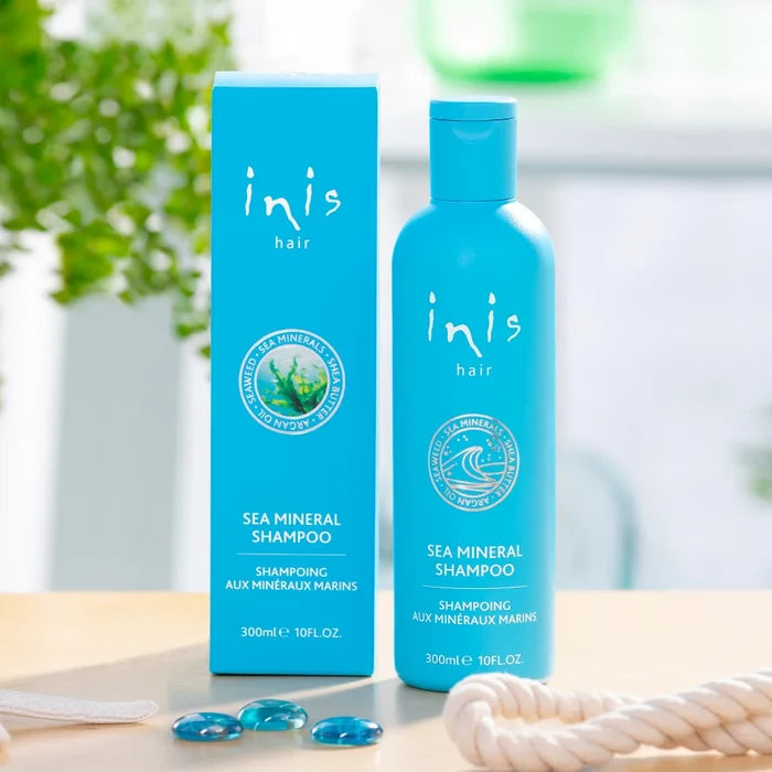 Blue bottle of Inis Hair Sea Mineral Shampoo (300ml / 10 fl. oz.) with matching turquoise box, featuring sea minerals logo and seaweed graphic on the packaging.