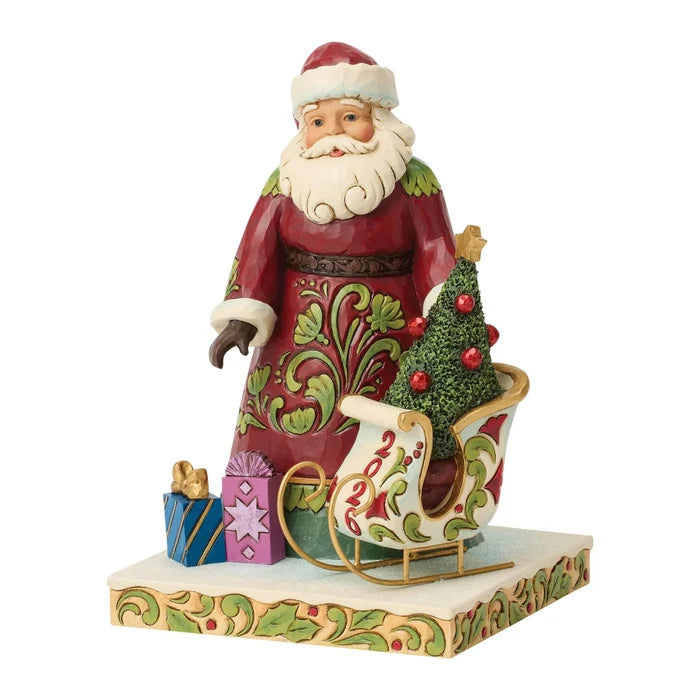 This Jim Shore 2026 Dated Santa Figurine features Jim Shore’s signature folk-art style, with intricate patterns, cheerful colors, and handcrafted details that create a warm and festive look.