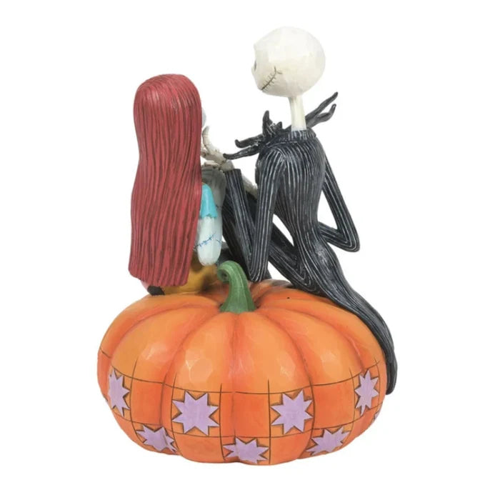 Jack and Sally figurine featuring Jack Skellington and Sally sitting together on a festive pumpkin.