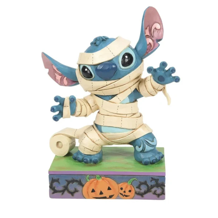 Mummy Stitch figurine featuring Disney's Stitch dressed in a playful mummy costume for Halloween décor.