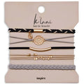 Grey and black hair tie bracelet with a gold flower accent in an elegant Inspire design.