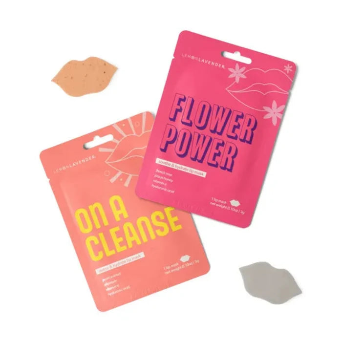 Two pink packages labeled 'On a Cleanse' and 'Flower Power' with a small beige and gray lip masks on a white background.