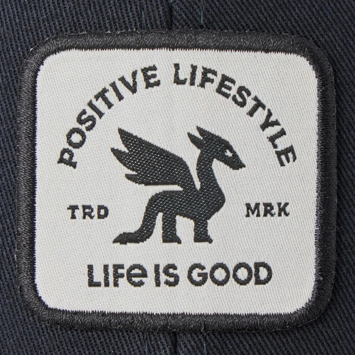 Life Is Good Adult Unisex Positive Lifestyle Dragon Patch Trucker Hat with bold woven dragon patch, structured cotton front, breathable mesh back, low-mid crown, and adjustable snapback closure