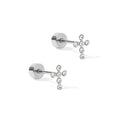 Pair of silver stud earrings with star-like design on a white background