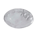 A silver plated oval tray displaying a starfish and a shell, elegantly arranged for decorative purposes.