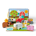 A colorful wooden toy set featuring various farm animals, including cows, pigs, and chickens, arranged on a play surface.