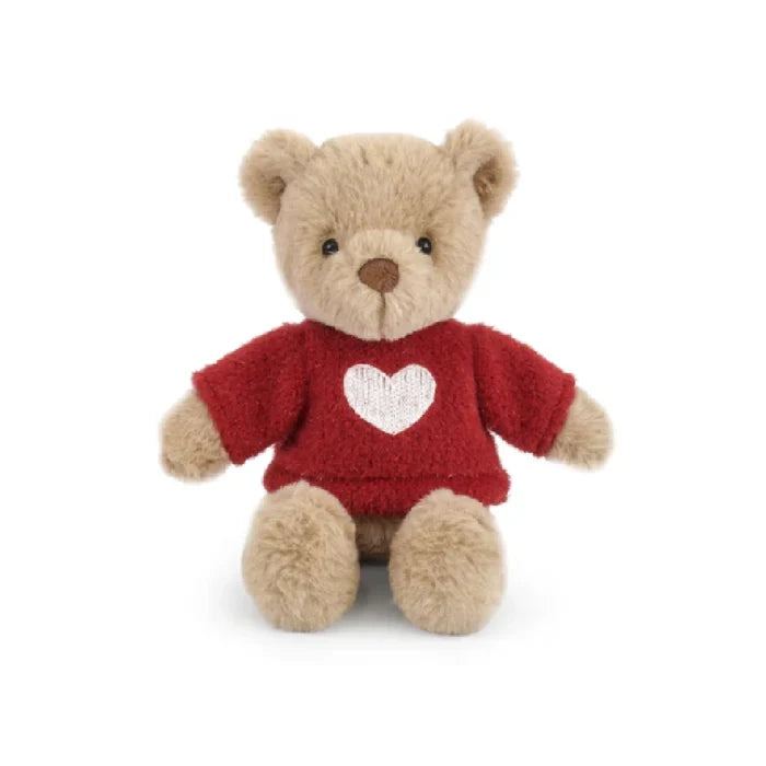 A teddy bear wearing a red sweater adorned with a heart symbol.